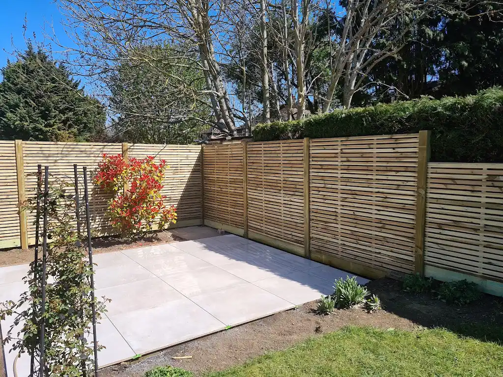 Contemporary slatted timber screening fence installed as a garden boundary by Bracknell Fencing LTD in Berkshire