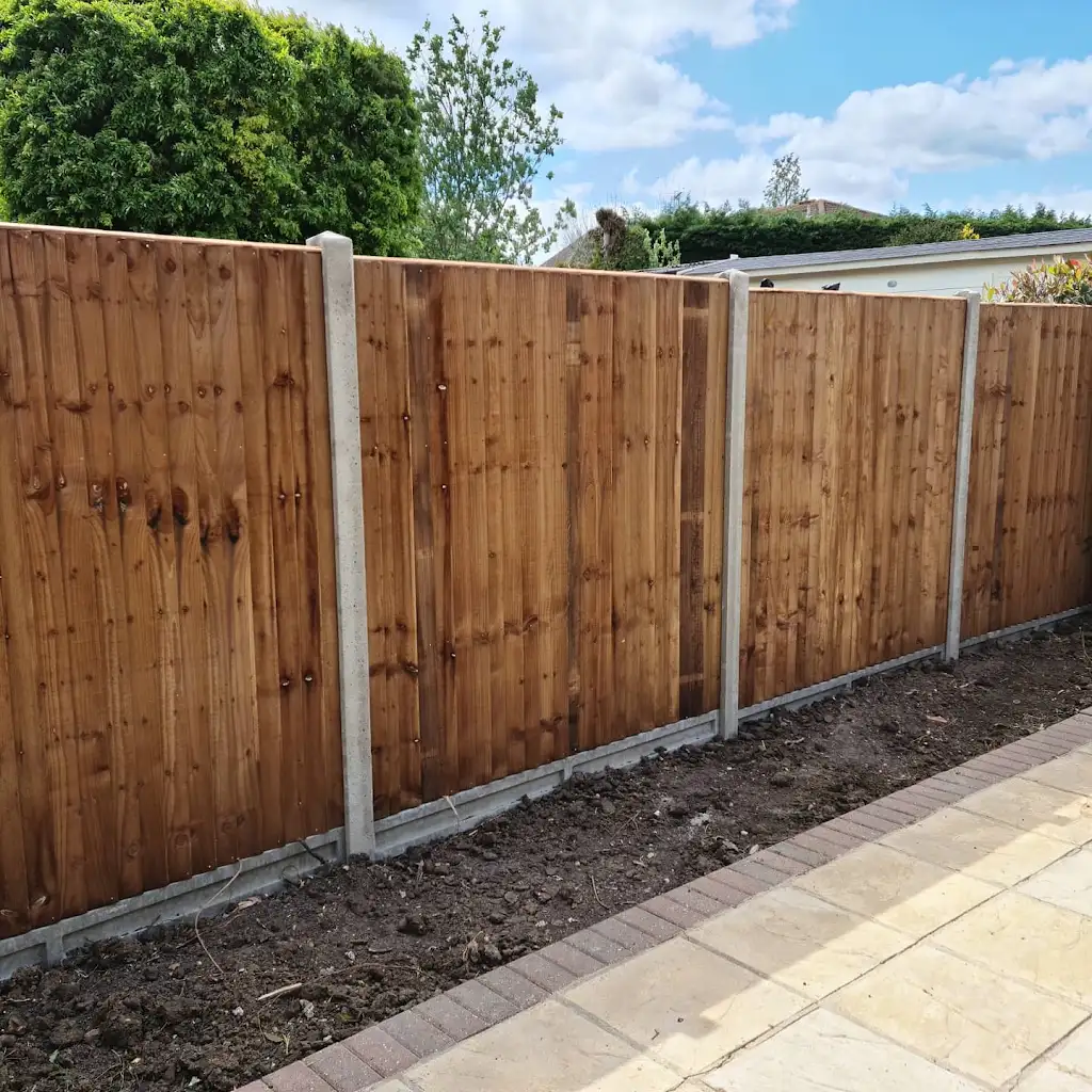 Closeboard featheredge fence panel installed with concrete posts and gravel boards by Bracknell Fencing LTD in Berkshire