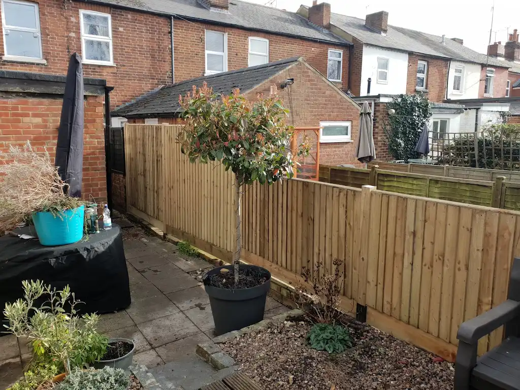 Closeboard featheredge fence panel installed with concrete posts and gravel boards by Bracknell Fencing LTD in Berkshire