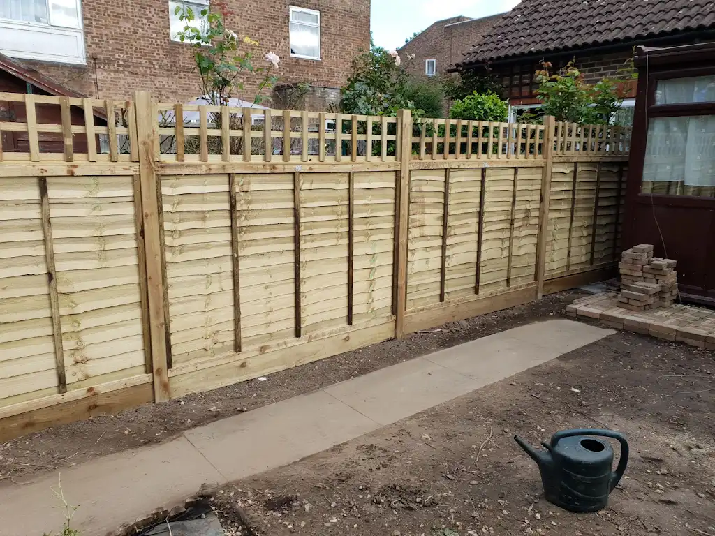 New overlap panel fencing installed between concrete posts and gravel boards by Bracknell Fencing LTD in Berkshire