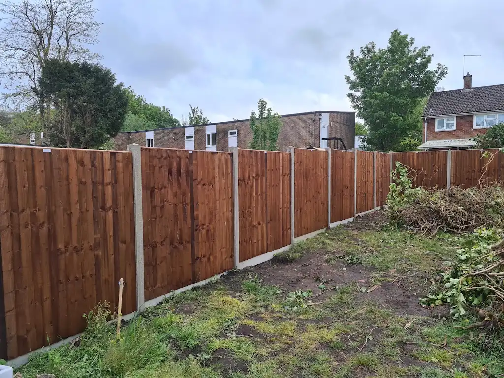 Closeboard featheredge fence panel installed with concrete posts and gravel boards by Bracknell Fencing LTD in Berkshire