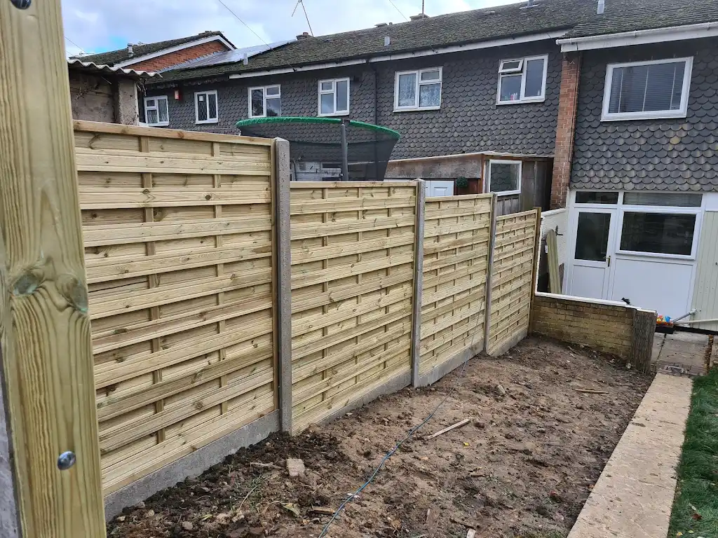 Contemporary slatted timber screening fence installed as a garden boundary by Bracknell Fencing LTD in Berkshire