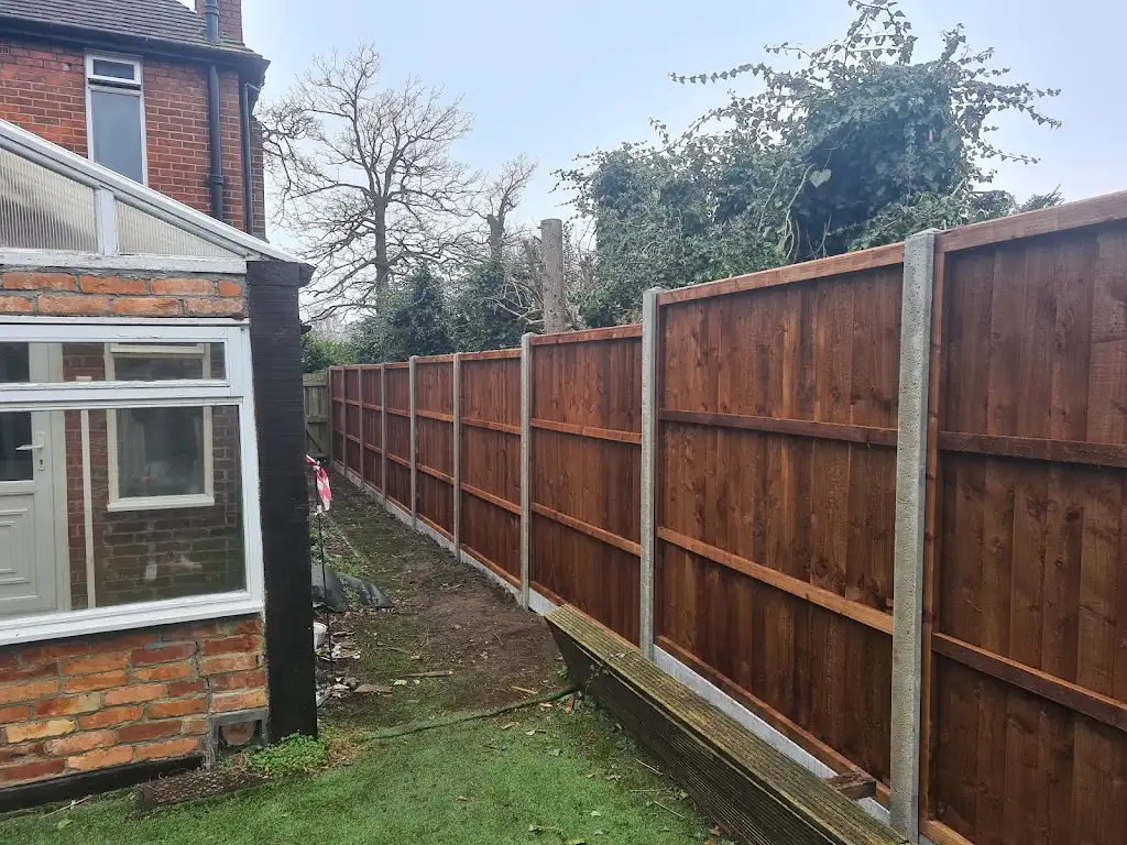 Closeboard featheredge fence panel installed with concrete posts and gravel boards by Bracknell Fencing LTD in Berkshire