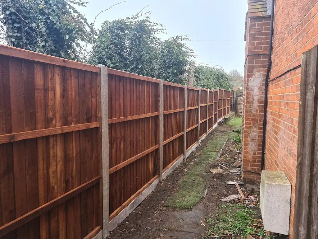 Closeboard featheredge fence panel installed with concrete posts and gravel boards by Bracknell Fencing LTD in Berkshire