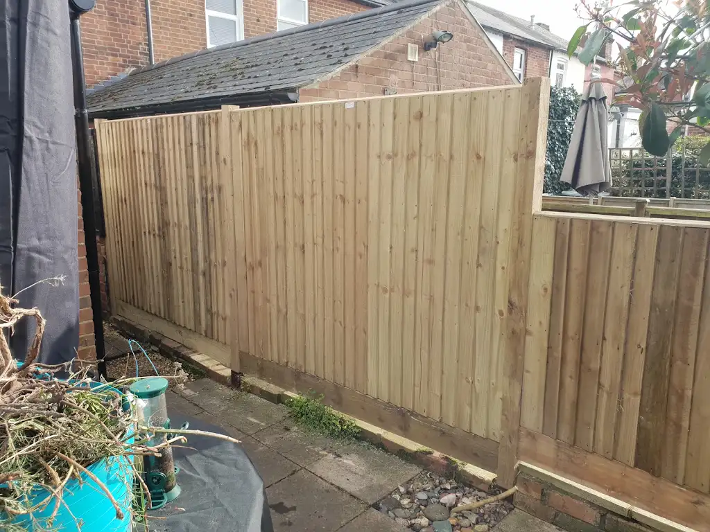Closeboard featheredge fence panel installed with concrete posts and gravel boards by Bracknell Fencing LTD in Berkshire