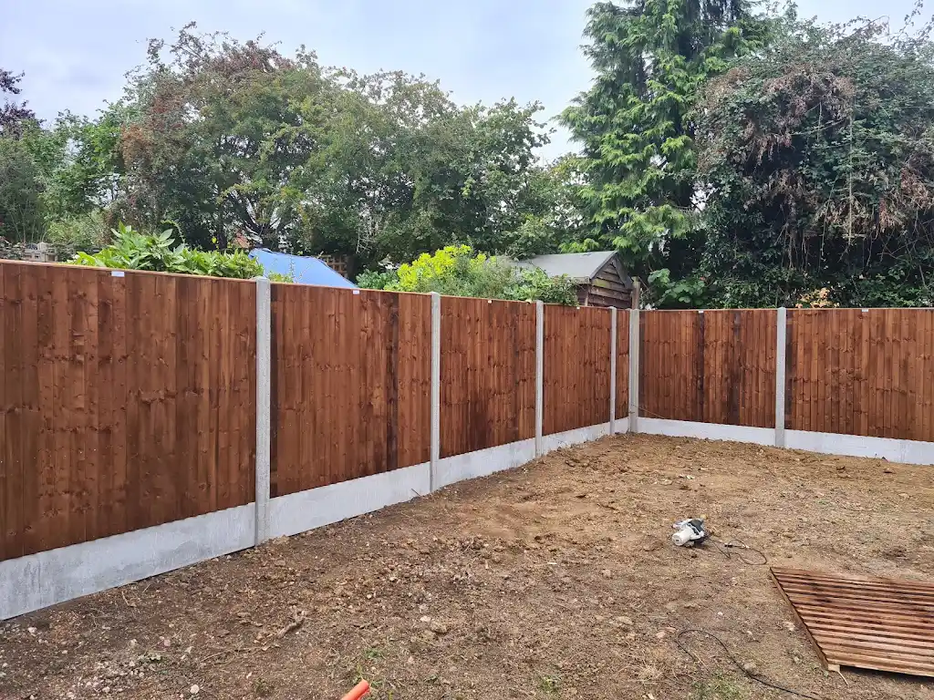 Closeboard featheredge fence panel installed with concrete posts and gravel boards by Bracknell Fencing LTD in Berkshire