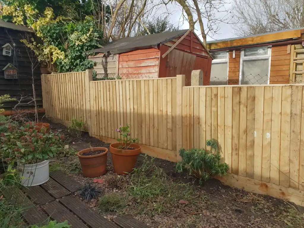 New timber fence panels installed along a garden boundary by Bracknell Fencing LTD in Berkshire